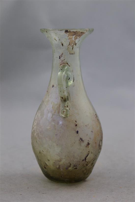A Roman clear glass two handled bottle vase, c.2nd century AD, 12.5cm